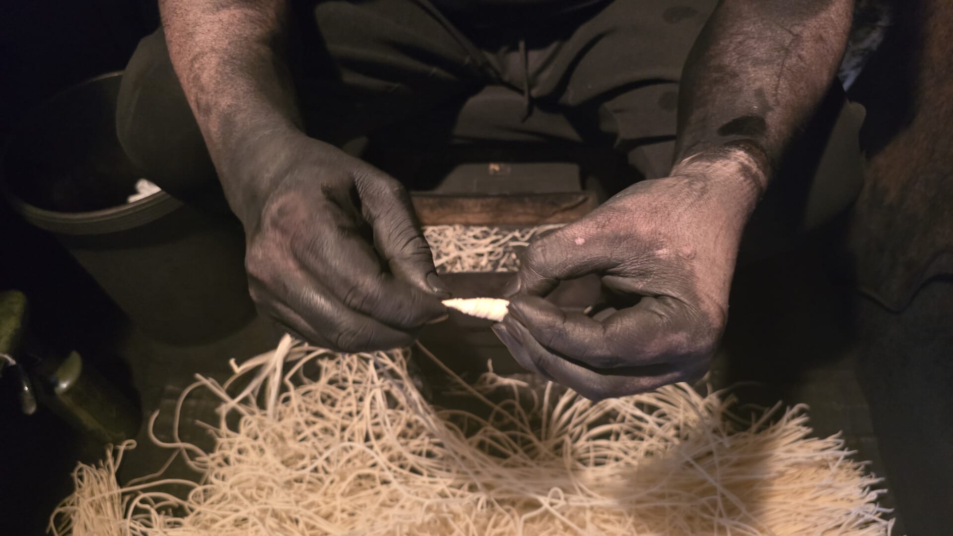 An Artisan Making Wicks for Soot Collection