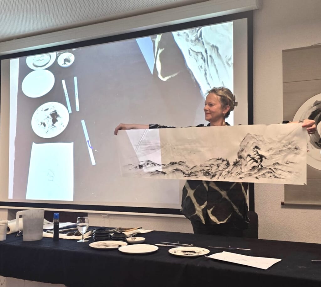 Margot giving a lecture at the Embassy of Japan in Switzerland in 2026.